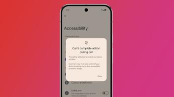 An Android phone on a pink and red background showing Android 16