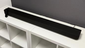 Sony Bravia Theatre Bar 8 soundbar on white storage unit in front of TV