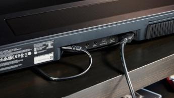 the black bose smart soundbar 2024 with remote, 2 touch controls on top, and mesh covering on top