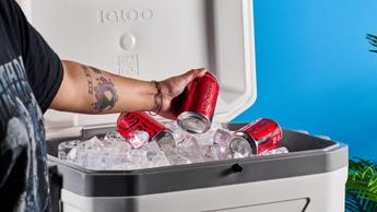 the igloo marine ultra 54 cooler in white with a latch, handles, a big igloo logo on the front and with a fish ruler and drink holders