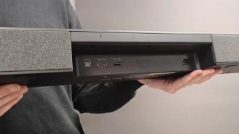 Amazon Fire TV Soundbar Plus Dolby Atmos soundbar held in hands showing rear connection cove