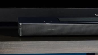 the black bose smart soundbar 2024 with remote, 2 touch controls on top, and mesh covering on top