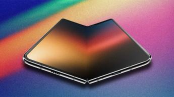 A foldable iPhone concept against a multi-colored background.