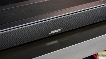 the black bose smart soundbar 2024 with remote, 2 touch controls on top, and mesh covering on top