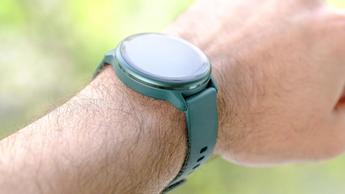 Close-up of the Garmin Vivoactive 6 smartwatch in green on a user's wrist