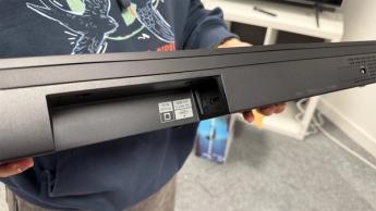 Sony Bravia Theatre Bar 6 soundbar held in hands showing rear connections cove