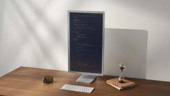 Boox Mira Pro 25.3-inch color E Ink monitor on a desk in vertical orientation