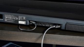 the black bose smart soundbar 2024 with remote, 2 touch controls on top, and mesh covering on top