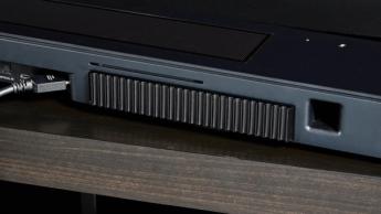the black bose smart soundbar 2024 with remote, 2 touch controls on top, and mesh covering on top