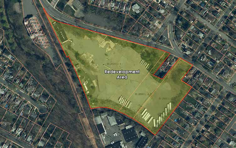 Aerial photograph of the Kingsland Street redevelopment area, outlined in red, showing the largely vacant parcel bounded by Kingsland Street to the north and residential streets to the east and south.