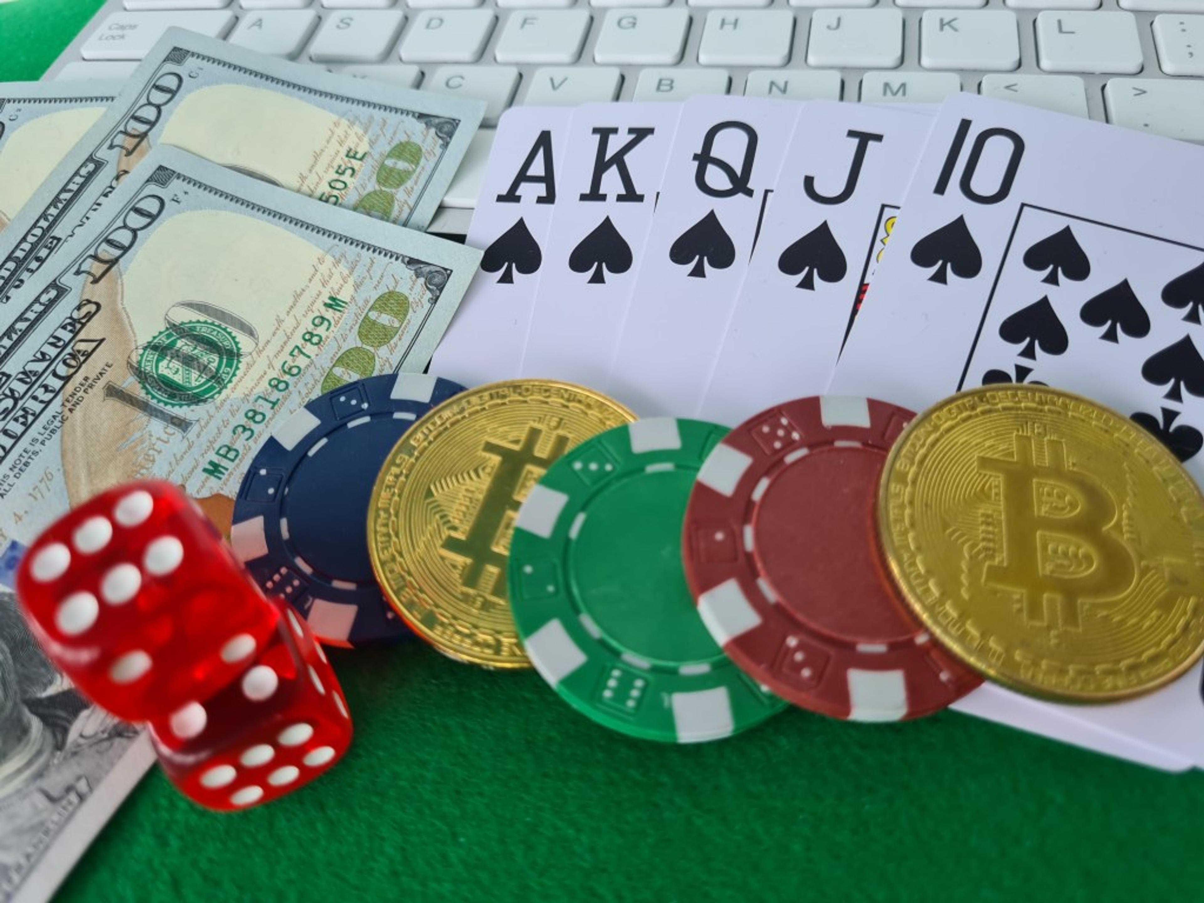 bitcoins-cards-dices-keyboard-closeup