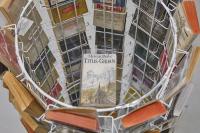 Infinite Summers (detail), 2019, Metal-wire rotating book and postcard stand, plastic and metal roller casters, 96 paperback novels, rubberbands, mirror foil, chair, 145 × 70 × 70 cm (undefined), Mark von Schlegell, Jan Kaps, Cologne