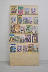 Return of the Lepidopters (detail), 2019, 24 Graphic novels and comics, wood display board, flatscreen television with digital file, plastic and cotton fiber bead curtain in green, neon pink-lit room, chair, Dimensions variable
(undefined), Mark von Schlegell, Jan Kaps, Cologne