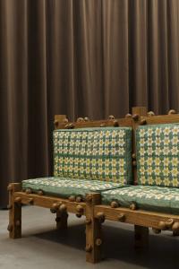Oak bench with narcissus and snails (detail), 2017, Oak wood, digital embroidery on cushion, 189 × 98 × 50 cm (undefined), Daniel Dewar & Grégory Gicquel, Portikus, Frankfurt