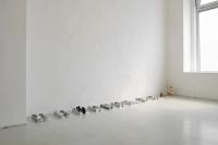 Untitled (UT), 2019, Cast aluminium UT benches, edible silver leaves, 3 Precious Moments salt shakers (Avon), 1 Precious Moments broken figure, black gesso, Lindt chocolate foil wrappers, plastic foil covered bunny family, cast aluminium 2018 bench model, Aveda travel soap, Dimensions variable (undefined), Nancy Lupo, Jan Kaps, Cologne