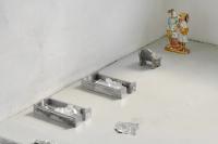 Untitled (UT) (detail), 2019, Cast aluminium UT benches, edible silver leaves, 3 Precious Moments salt shakers (Avon), 1 Precious Moments broken figure, black gesso, Lindt chocolate foil wrappers, plastic foil covered bunny family, cast aluminum 2018 bench model, Aveda travel soap, Dimensions variable (undefined), Nancy Lupo, Jan Kaps, Cologne