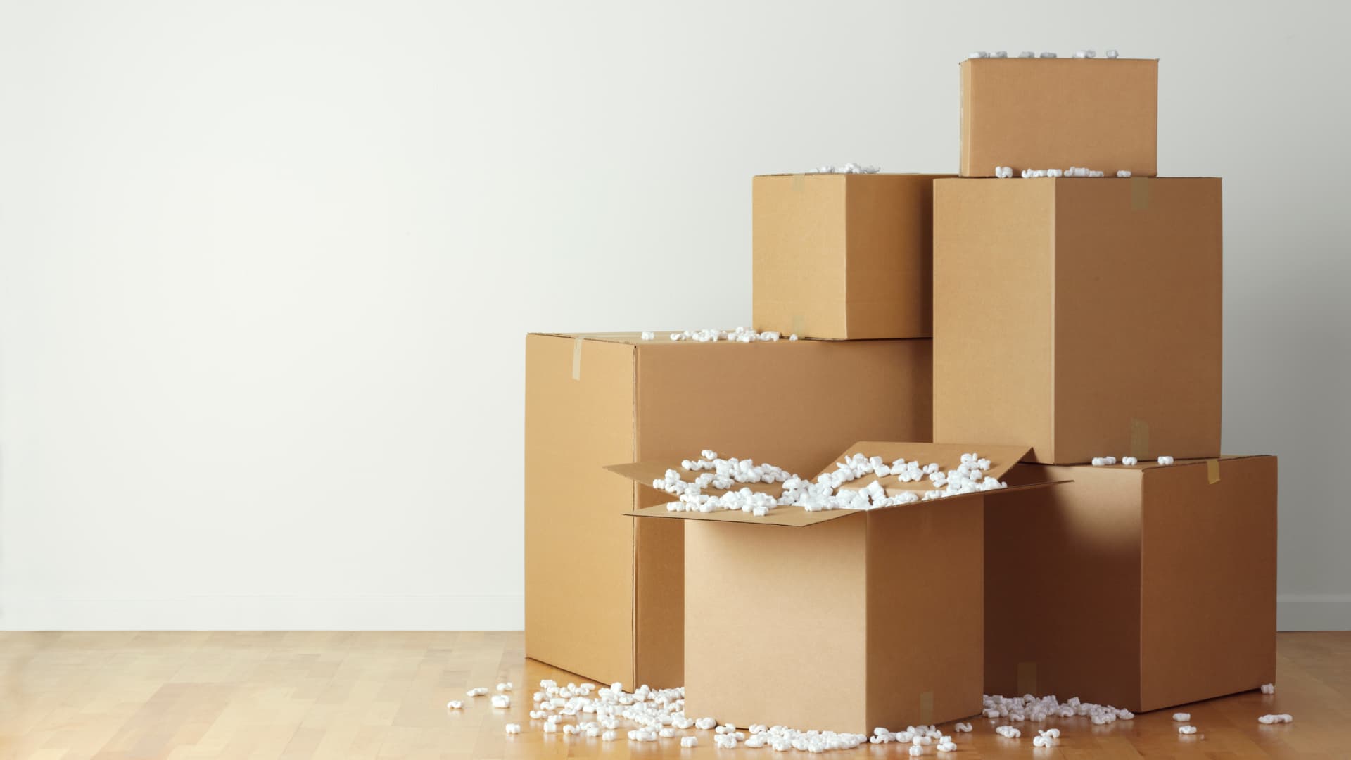 A stack of boxes with packing peanuts