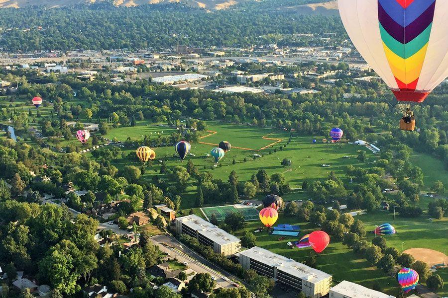 Hot air balloons rising over the boise valley