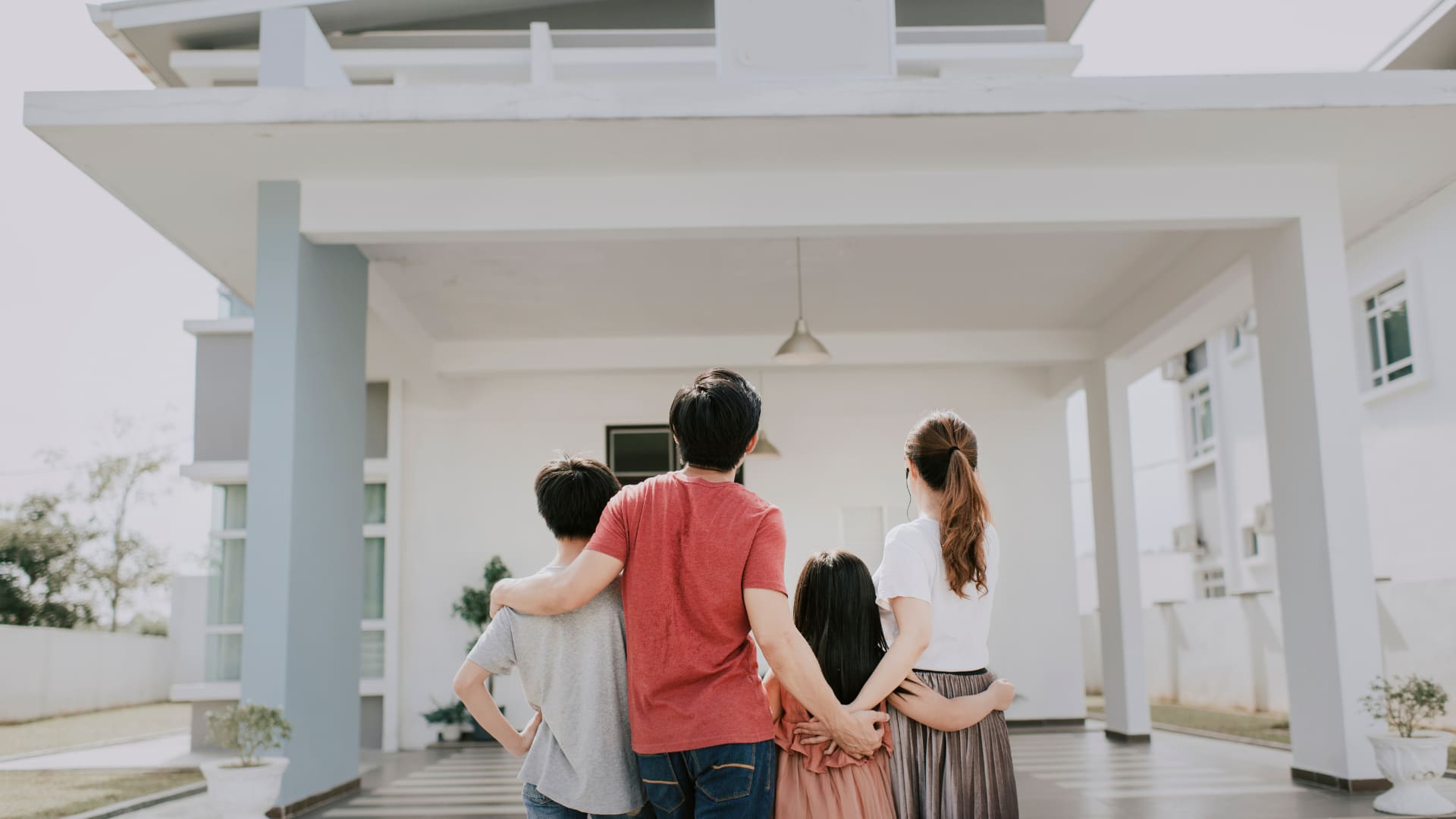 A family looking up at their new boise home