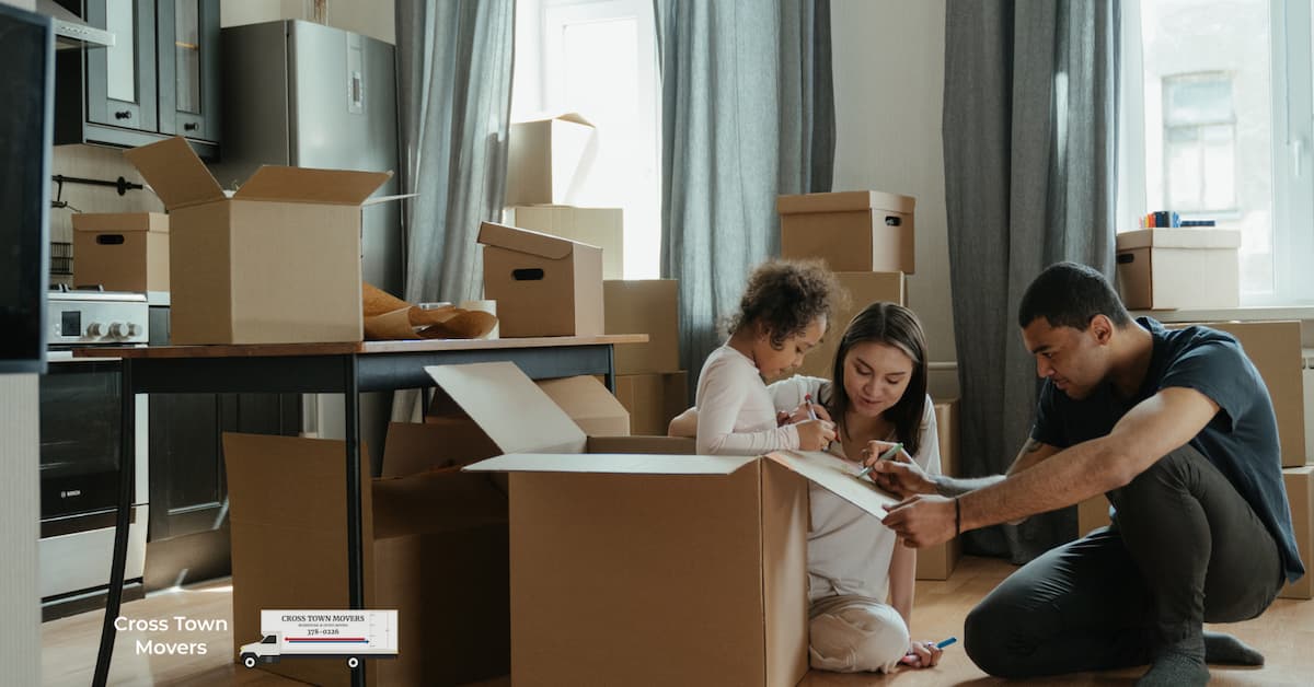 Family packing up their home | What to do the night before you move Cross Town Movers Boise