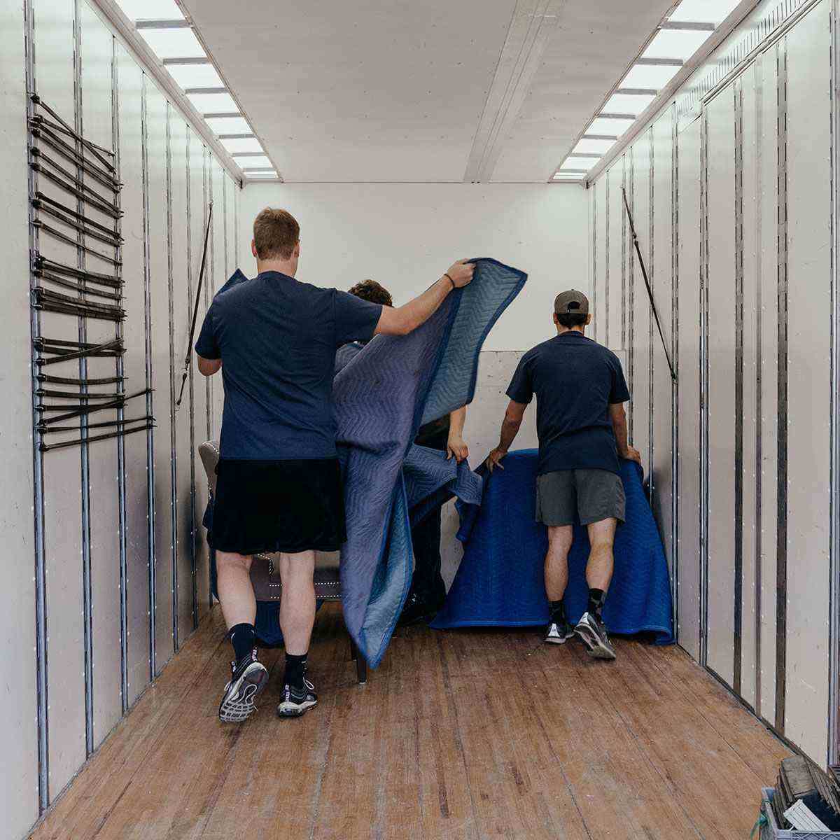 Two Cross Town Boise Movers Employees packing a truck