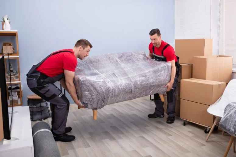 moving staff moving sofa after packing