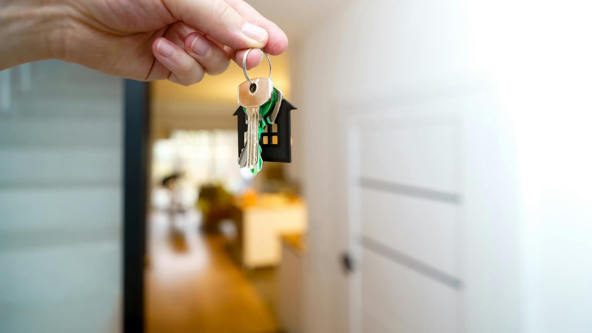 a person holding house keys