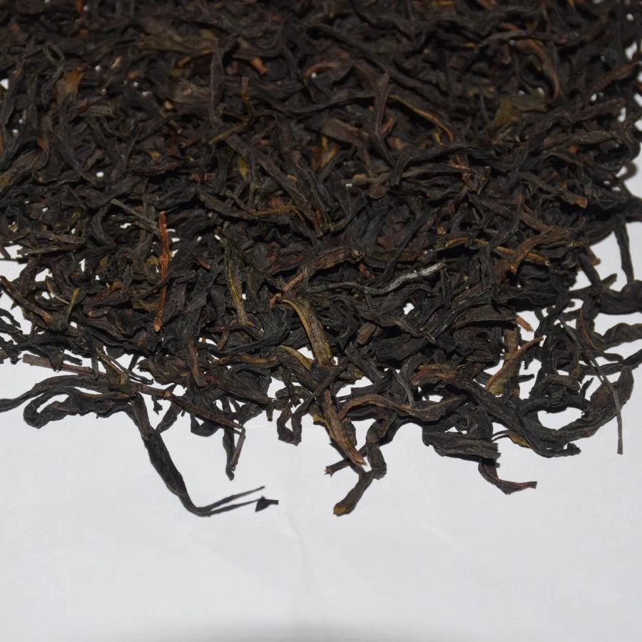 Wholesale premium Mi Lan Xiang (Honey Orchid) Phoenix Dan Cong Oolong tea, showing traditional twisted and wiry dry leaves.