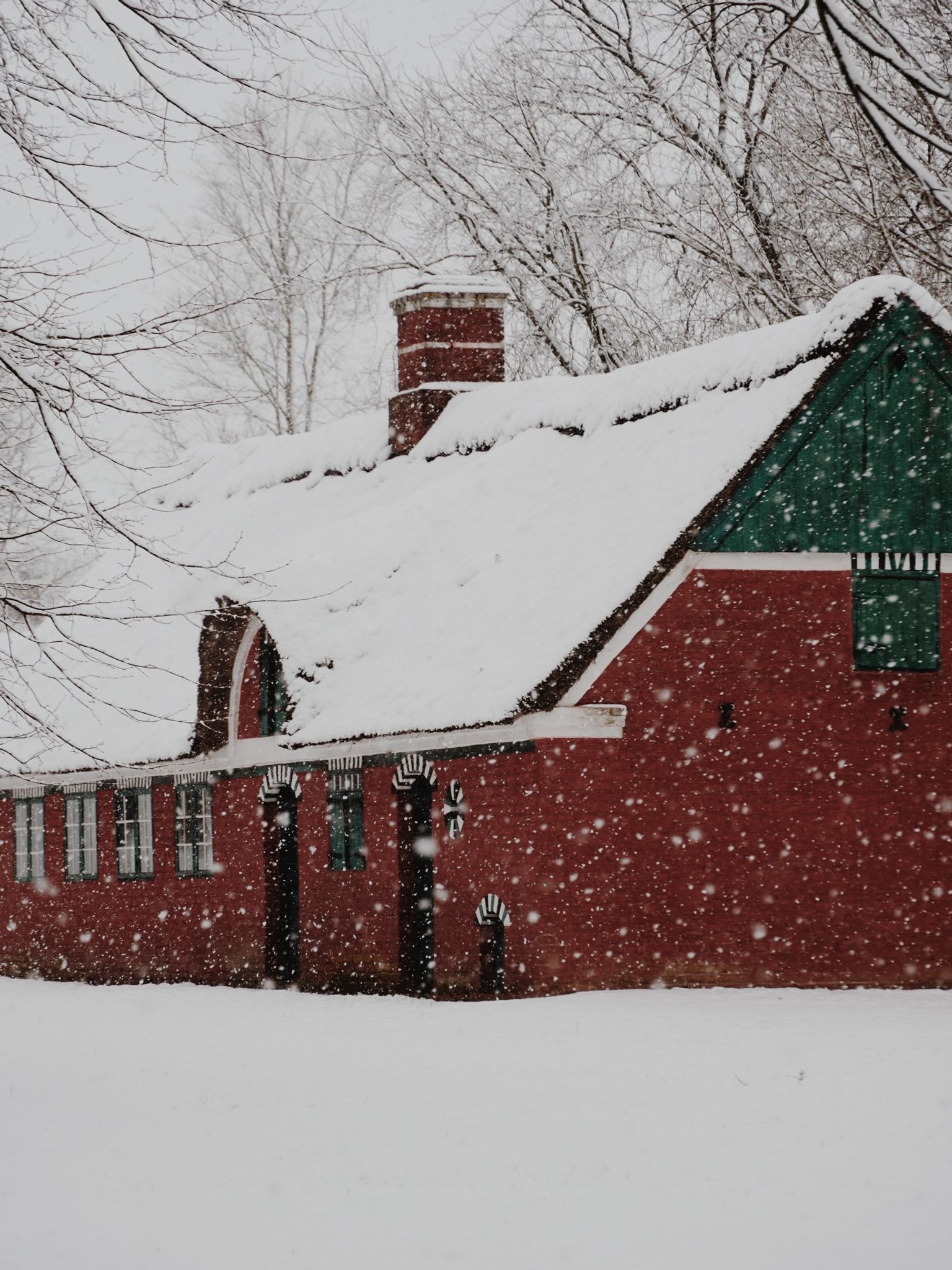 Red hisoric house in snow