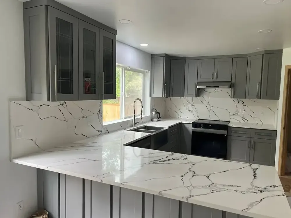 White Shaker cabinets with marble countertop and island, Redmond