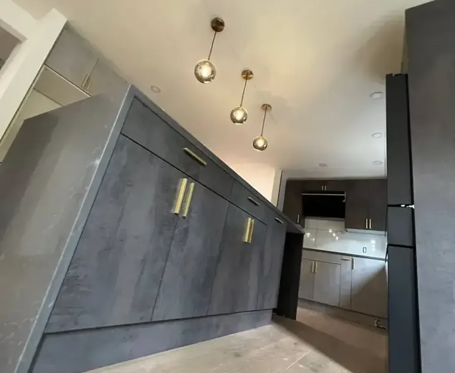 Gray concrete-style kitchen cabinets with pendant lighting Bellevue
