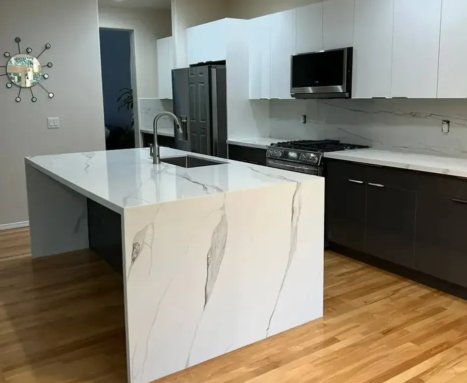Gray marble countertop island with fireplace accent wall kitchen renovation