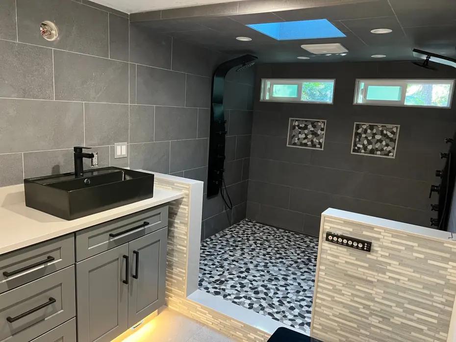 Glass enclosed shower with subway tile and black fixtures Kirkland