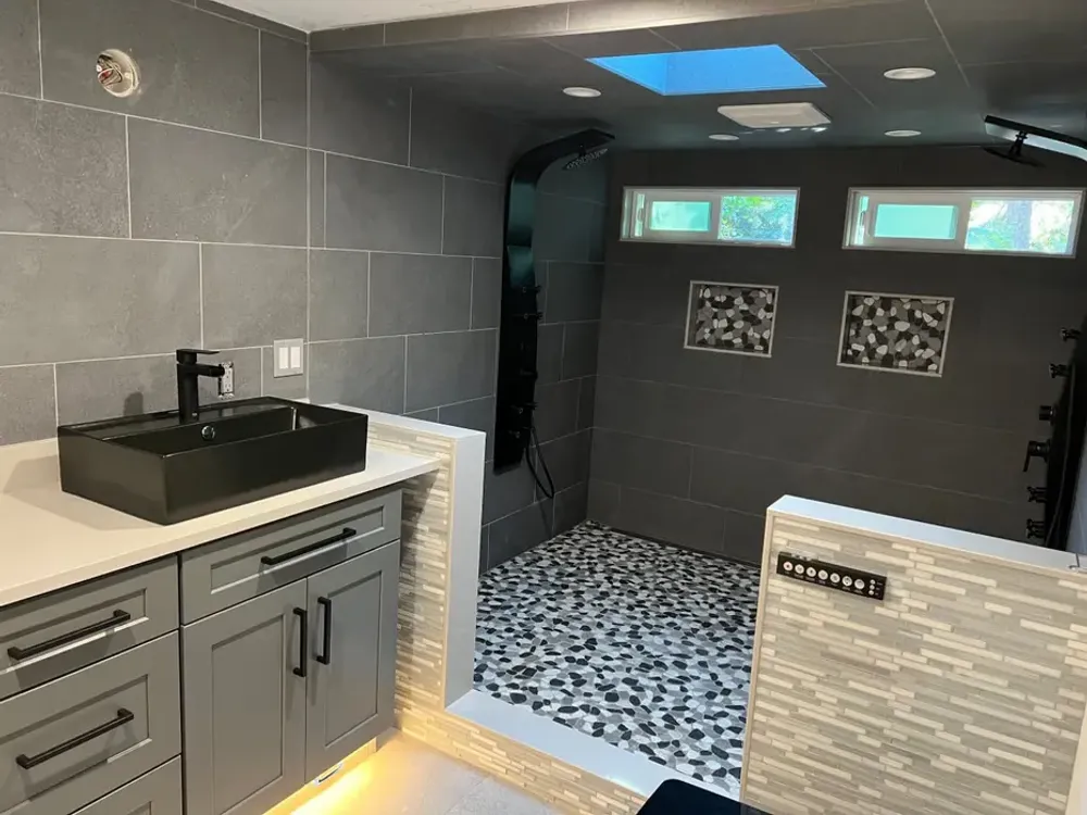 Vanity with a black vessel sink