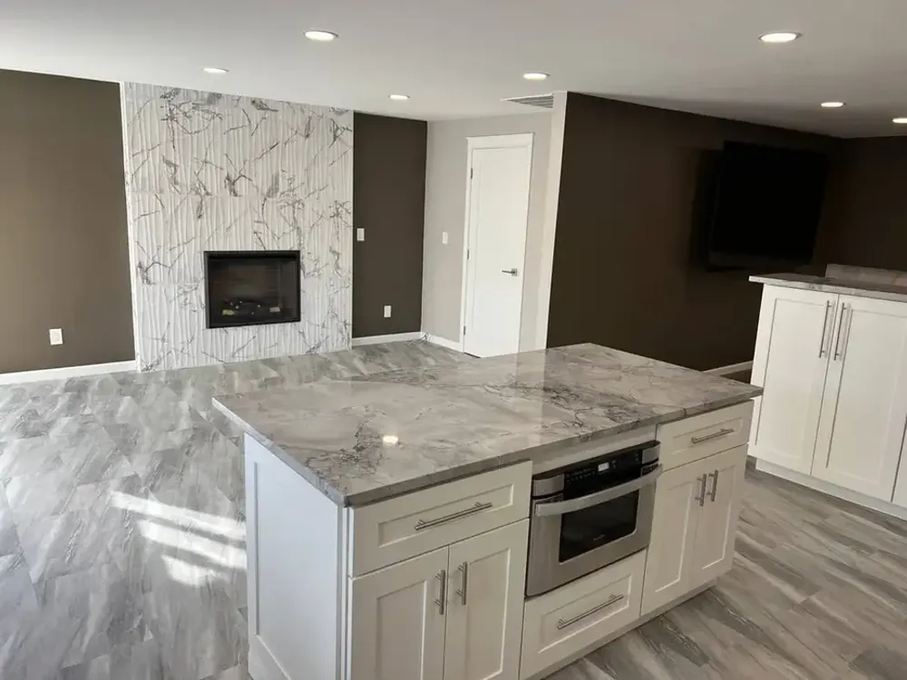 Quartz waterfall island countertop in a modern kitchen