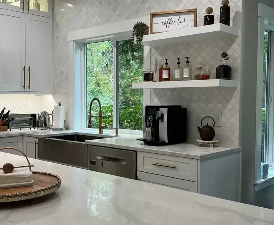 Quartz countertop with arabesque tile backsplash and coffee bar