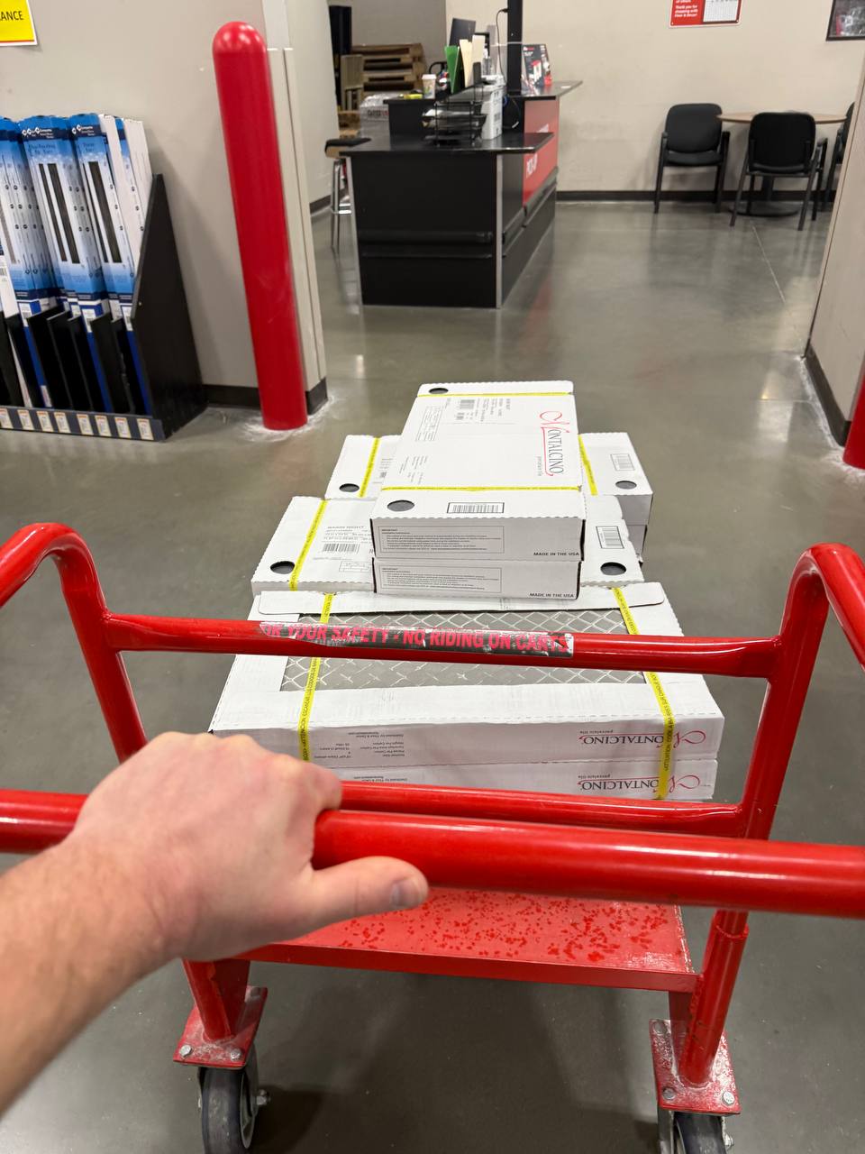 Boxes of materials on a delivery cart at a job site