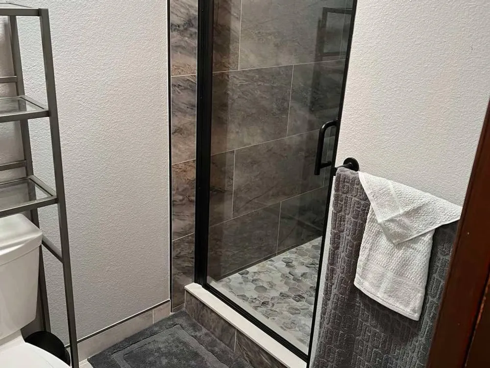 Tiled wall with black fixtures