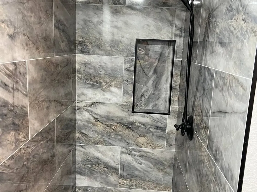 Large format tile floor in a remodeled bathroom