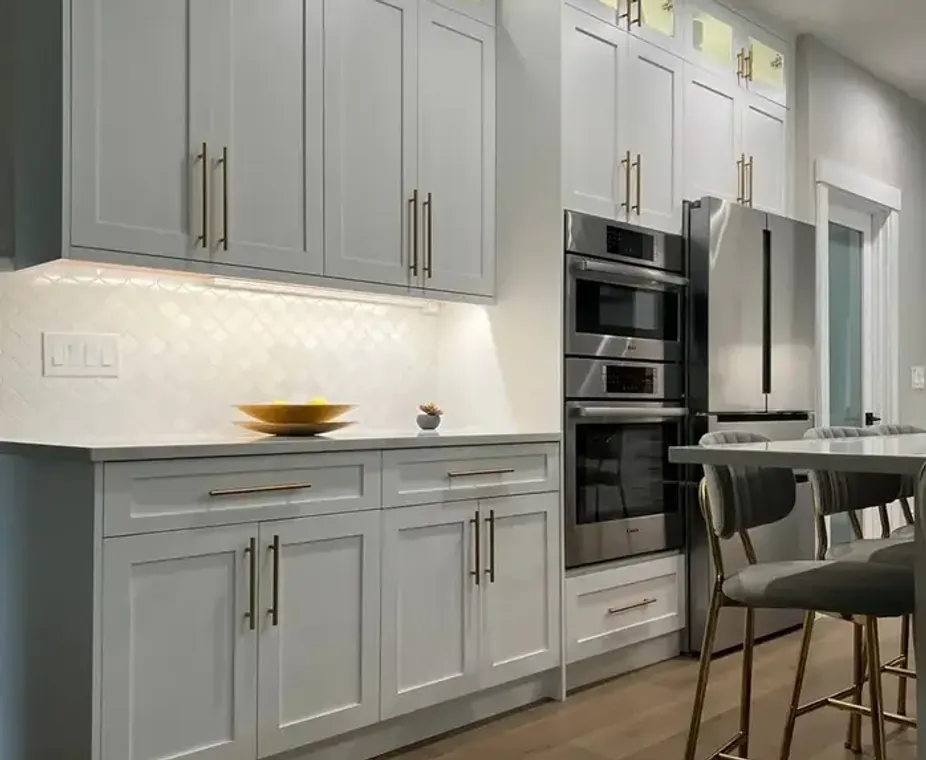 White Shaker kitchen cabinets with gold hardware installed in Bellevue WA