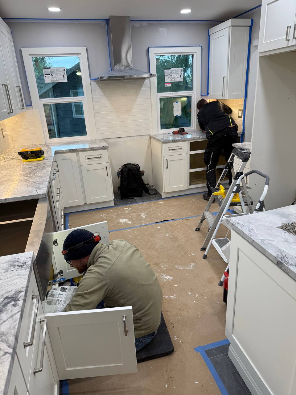 Kitchen during a remodel with the old counters removed