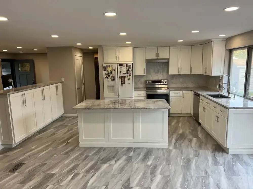 Marble-look quartz countertops with gray Shaker cabinets