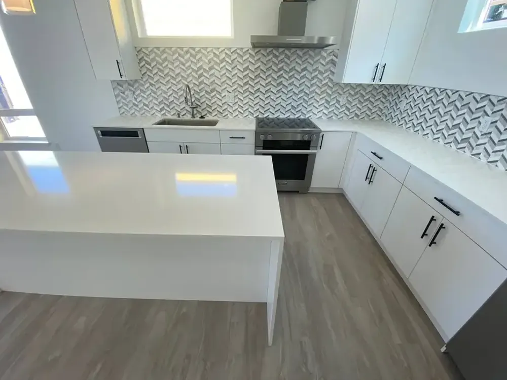 Gray kitchen with quartz island countertop