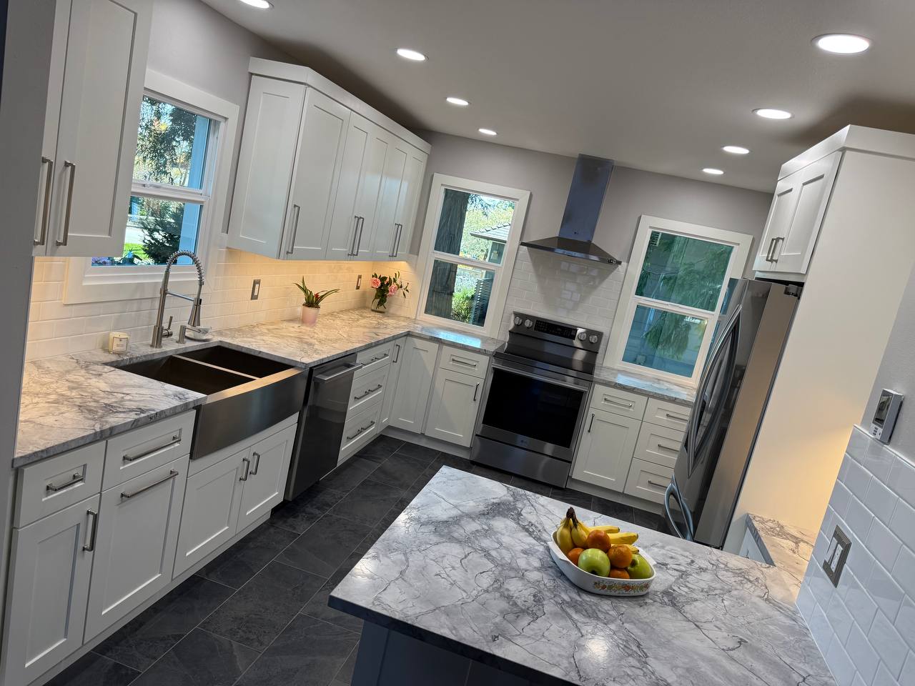 Farmhouse sink set into marble-look counters