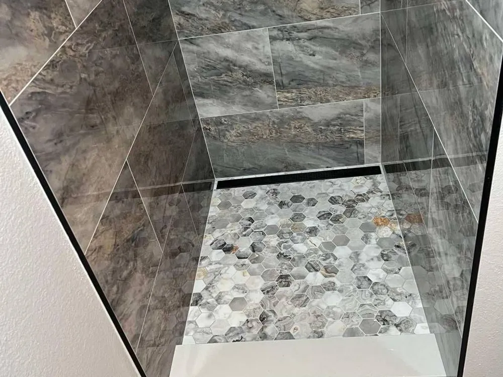 Tile floor and walls in a renovated bathroom