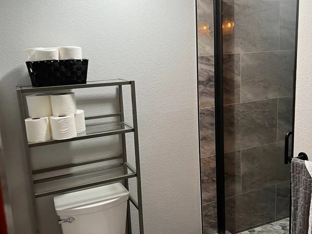 Open shelving in a remodeled bathroom