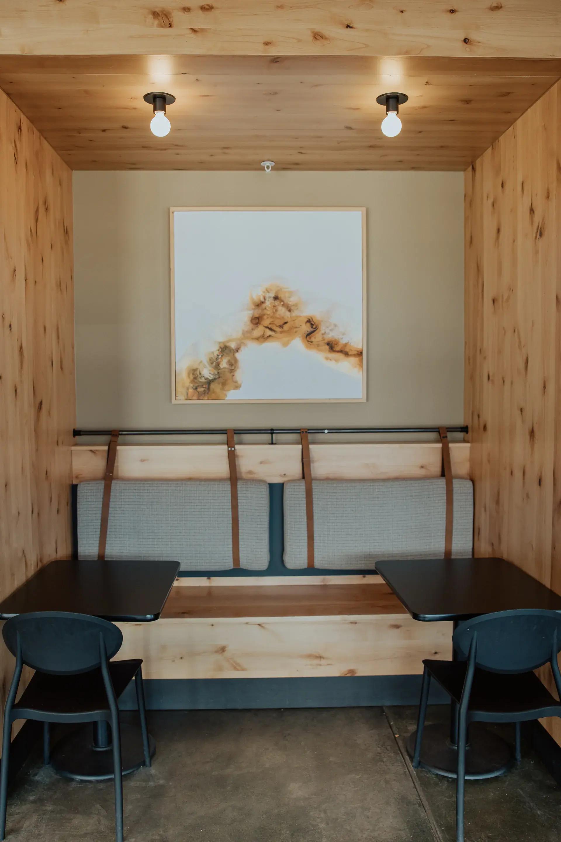 A cozy dining area with a booth and tables