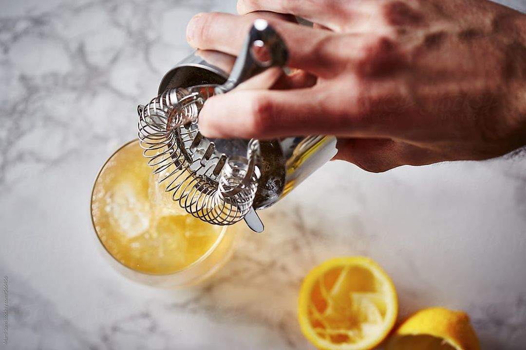 Bartender making the Orange Ricotta Pancakes cocktail