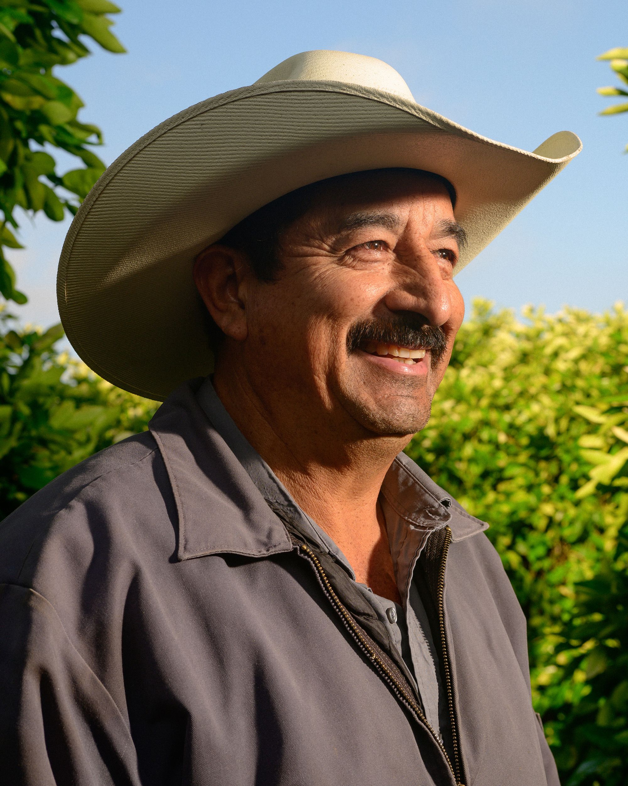 Farmer profile smiling with hat