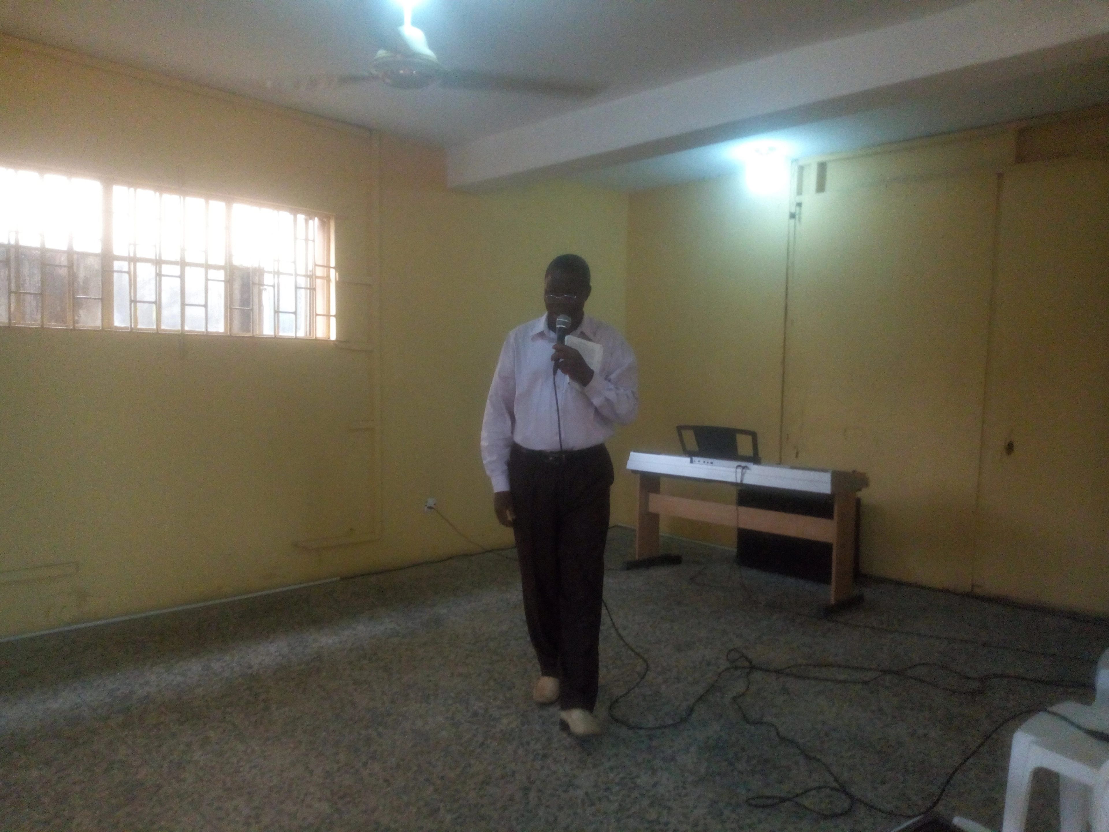 Pastor Z.A preaching to the first 3 members of the ministry